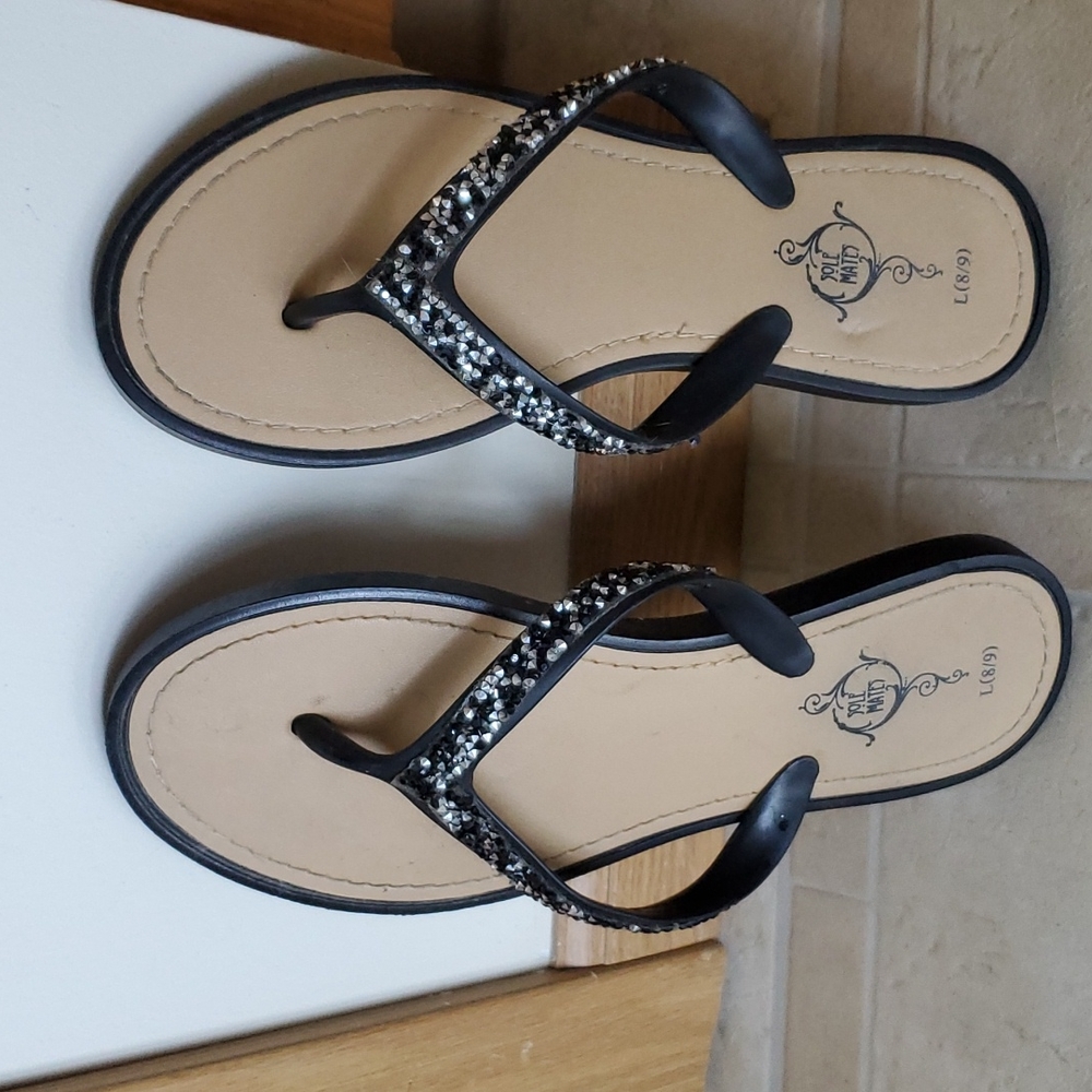 Black and tan sandals.